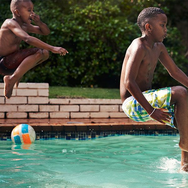 Kids jumping into pool