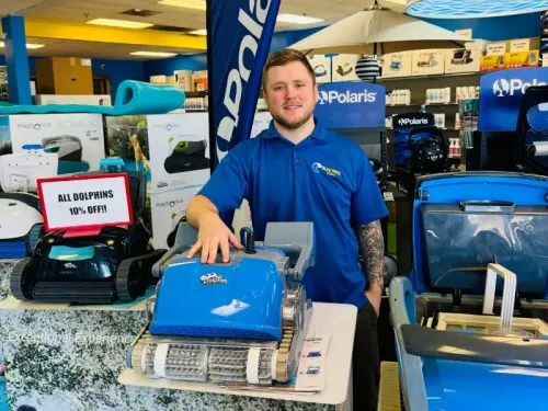 Blue Wave employee standing with Dolphin cleaners.