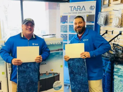 Blue Wave boys holding pool liners.